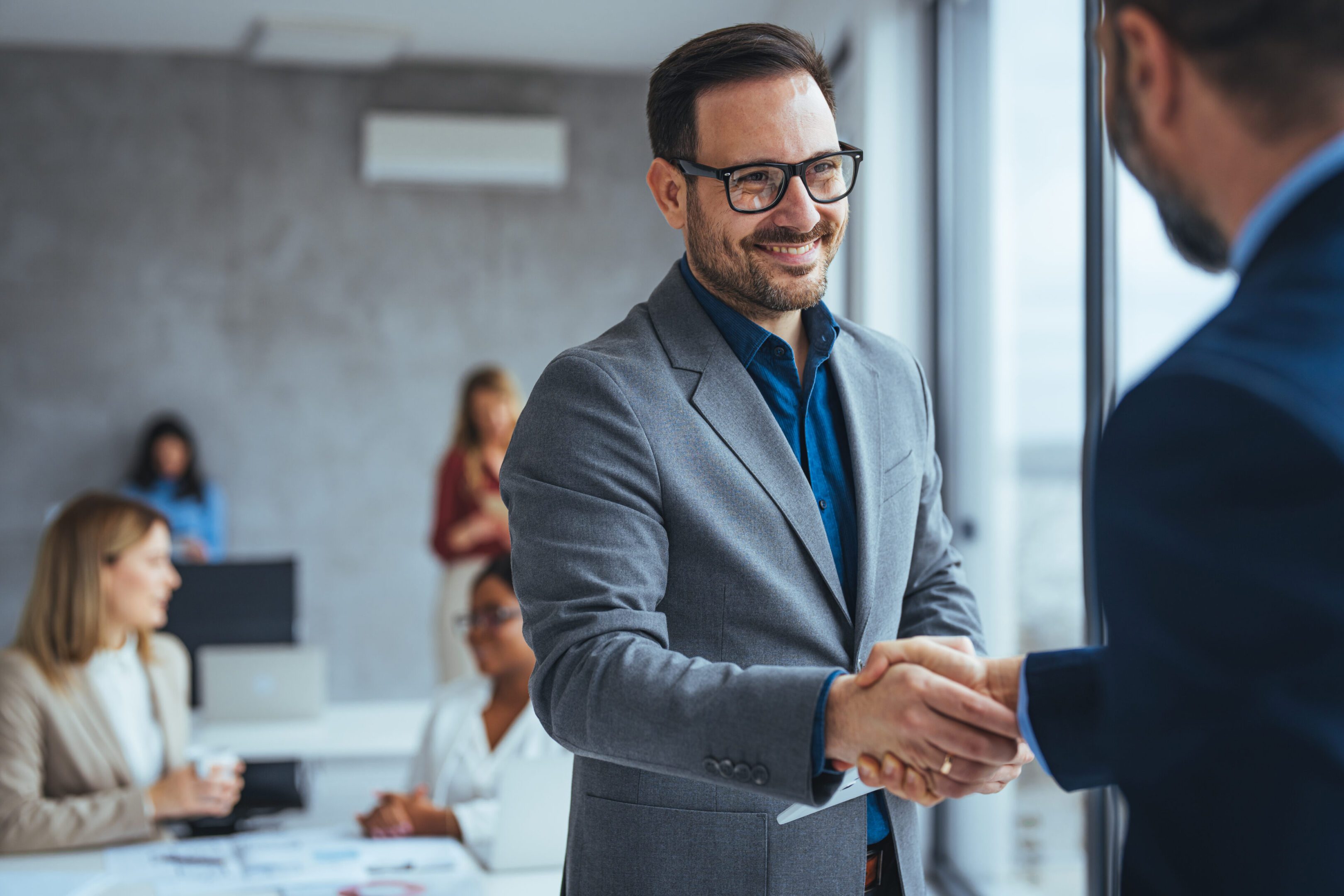 Professional handshake during meeting