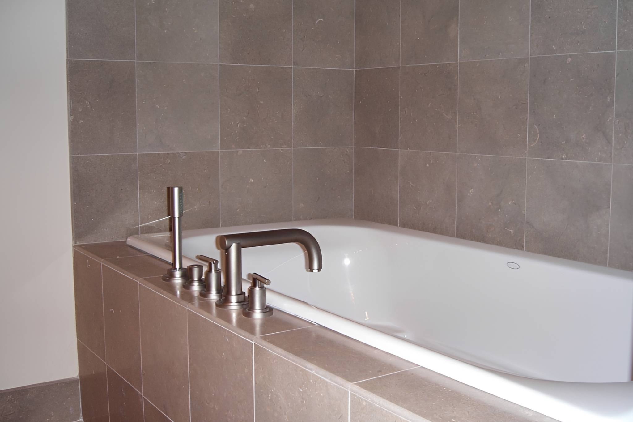 Elegant bathroom with tiled tub