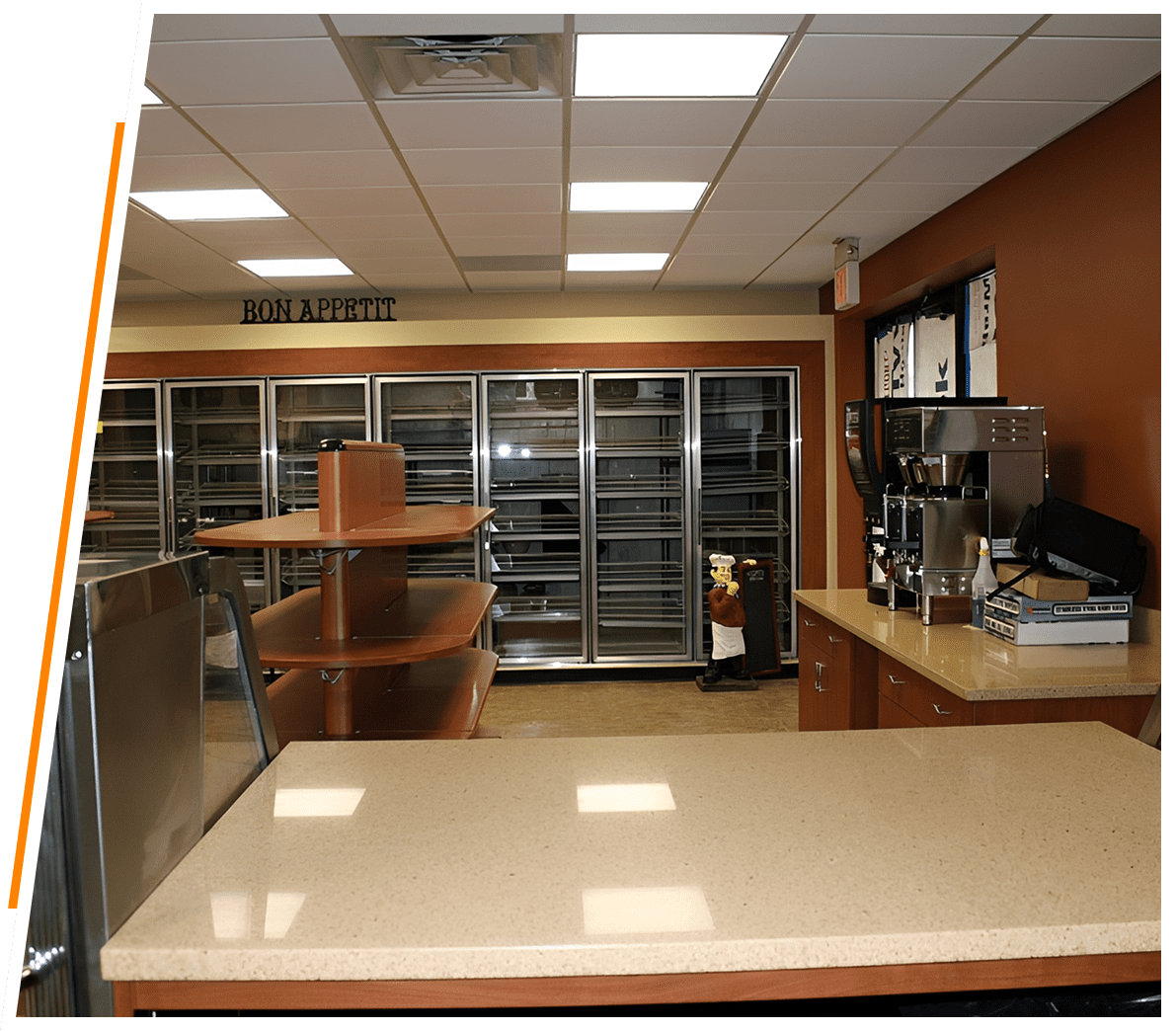 Modern kitchen area with beige countertops
