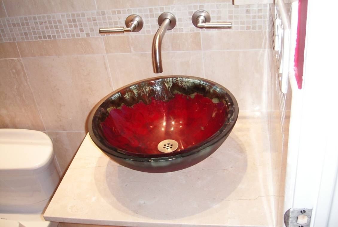 Modern sink with metallic fixtures