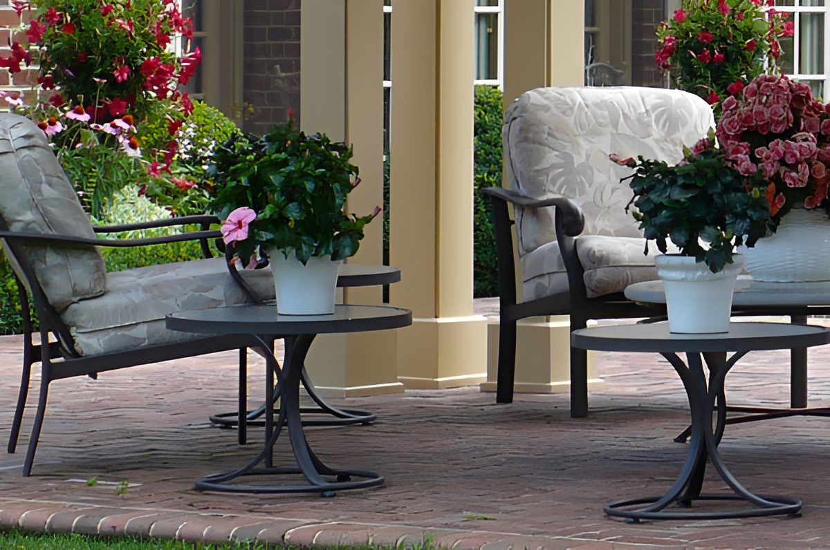 Garden chairs and tables with plants